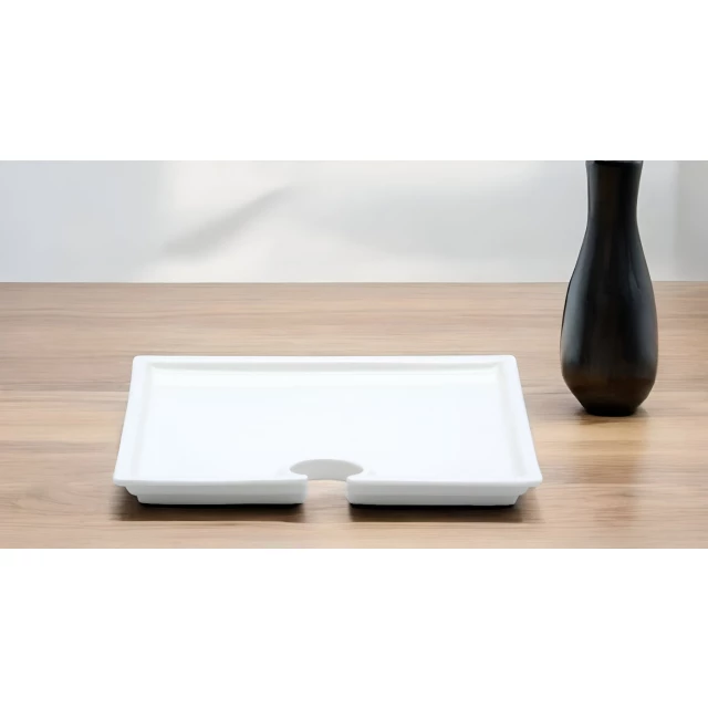 white porcelain appetizer plates wine holder on grey wood surface