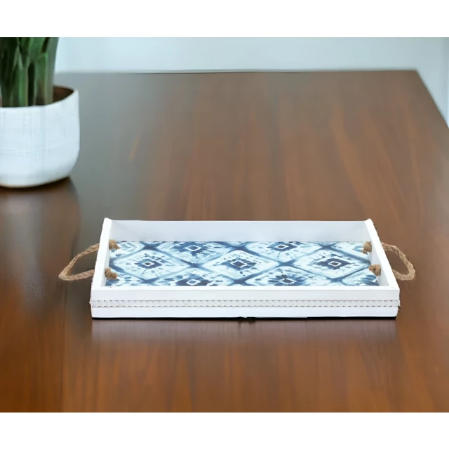 white solid wood vanity tray with handles on table with houseplant and dishware