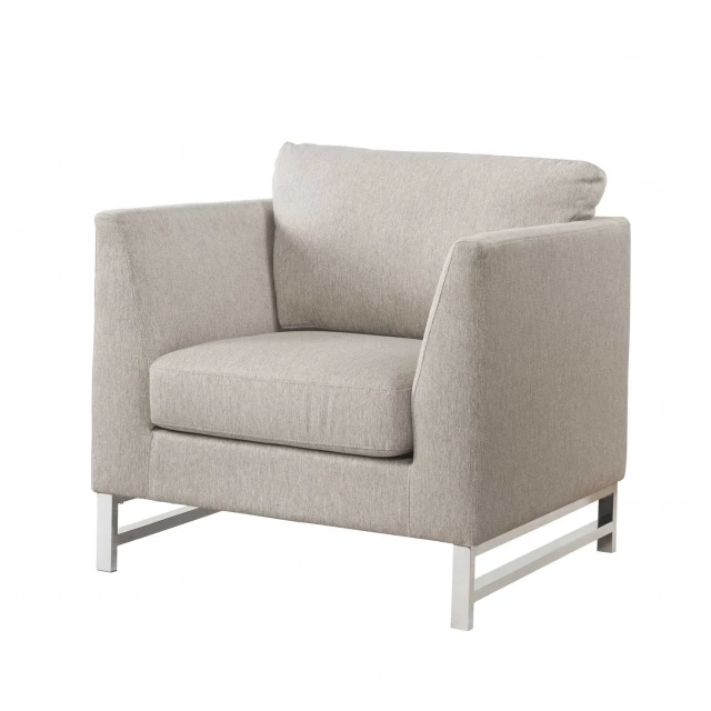 Beige linen upholstery chair with metal legs and wooden armrests in a studio setting