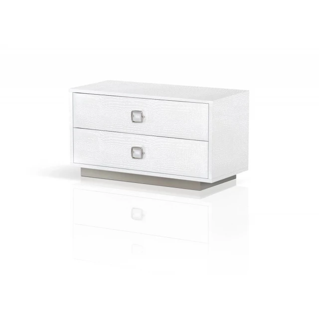 White drawer nightstand with simple design and modern electronics accessory detail