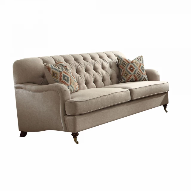 Beige fabric upholstery sofa with comfortable pillows and modern outdoor furniture design