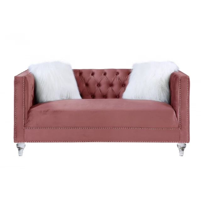 Silver velvet love seat with toss pillows and wooden legs
