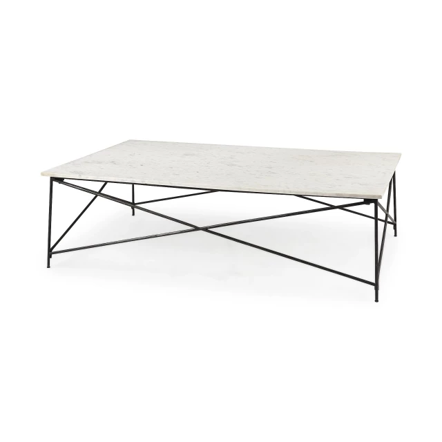 Marble criss cross base coffee table with rectangular top and tree shade in outdoor setting