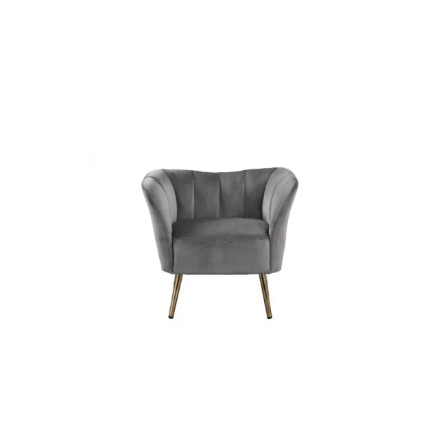 Gray velvet gold striped barrel chair with wood armrests and hardwood flooring