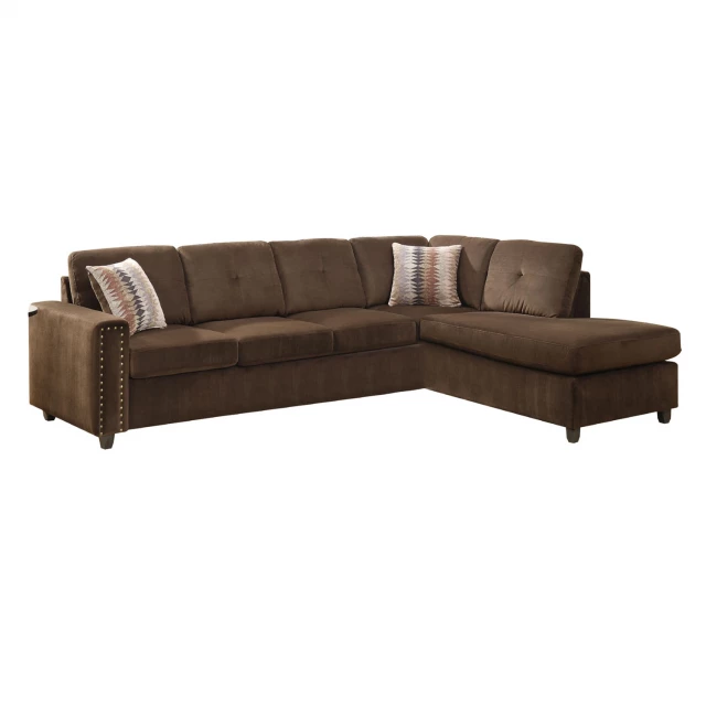 Brown velvet L-shaped sofa chaise sectional with wood accents and sofa bed functionality in a studio setting