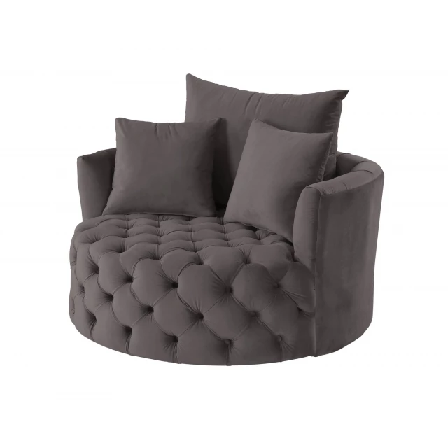 Gray velvet solid swivel barrel chair in a comfortable studio setting
