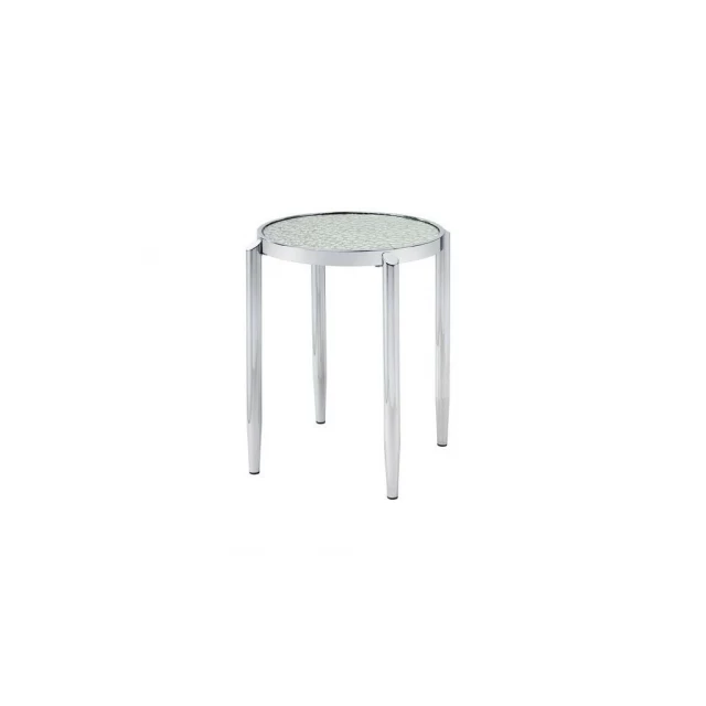 Silver mirrored metal round end table in a modern outdoor setting