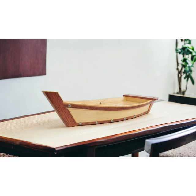 brown wood sushi boat serving tray made of hardwood with varnish
