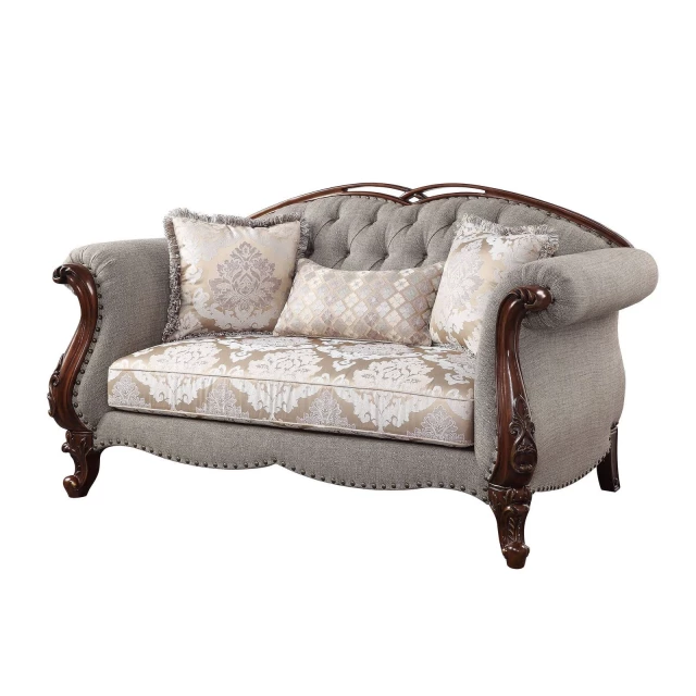 Dark brown linen loveseat with toss pillows and comfortable armrests suitable for outdoor use