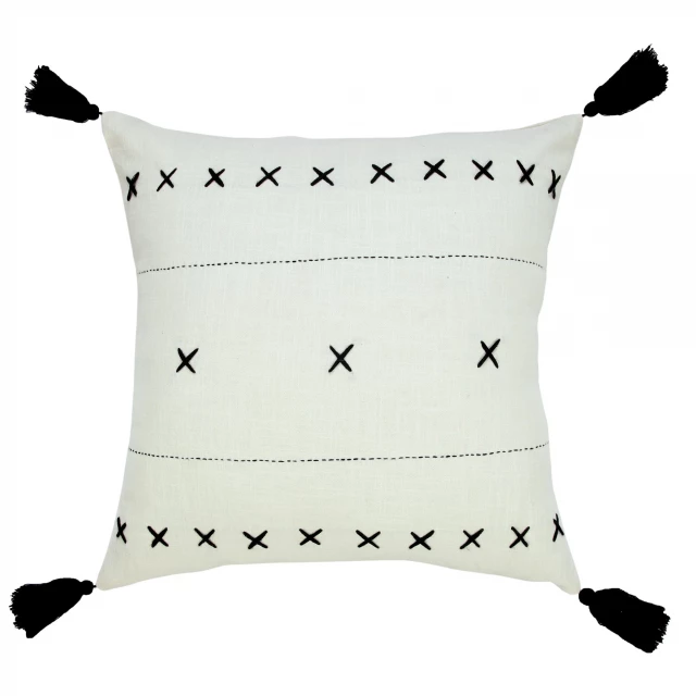 White and black cotton geometric zippered pillow on linen serveware background
