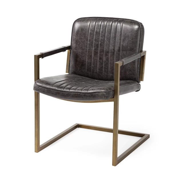 Leather seat accent chair with brass frame and armrest for comfortable indoor seating
