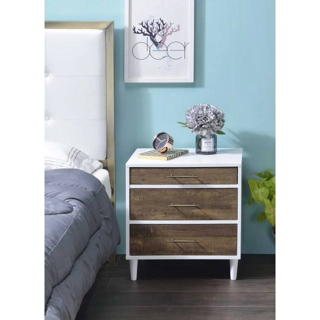 Brown wooden nightstand with drawers and grey interior design accents including a plant