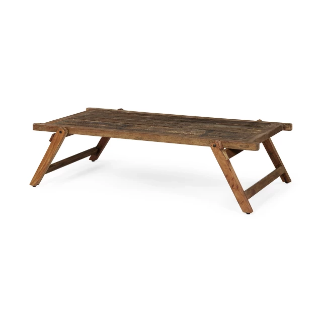 Naturally finished reclaimed wood coffee table in rustic outdoor setting