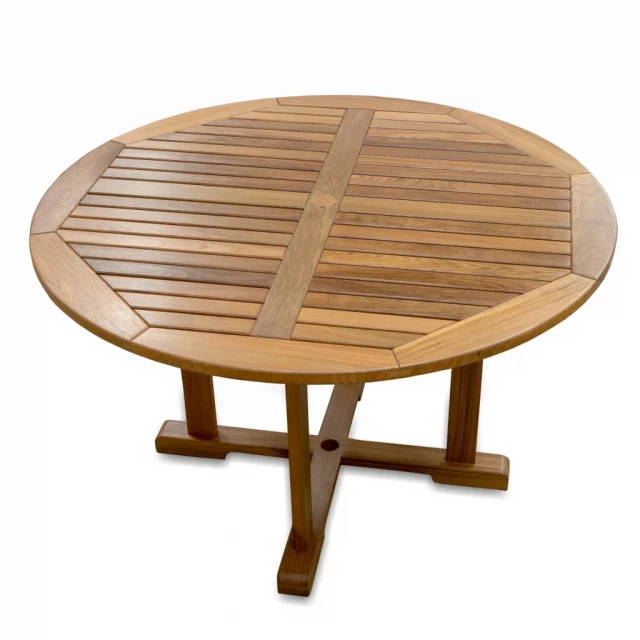 Round solid teak wood dining table with chairs and natural wood stain finish