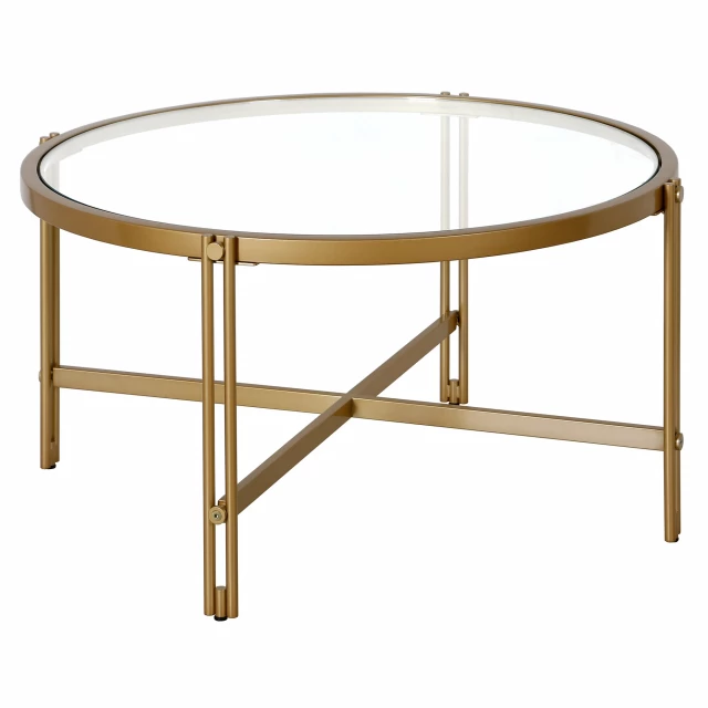 Gold glass steel round coffee table with circle and oval shapes in an outdoor setting