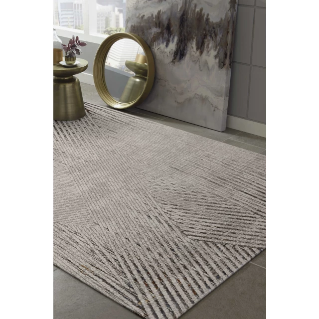 woven geometric lines indoor area rug with grey tones and rectangular pattern