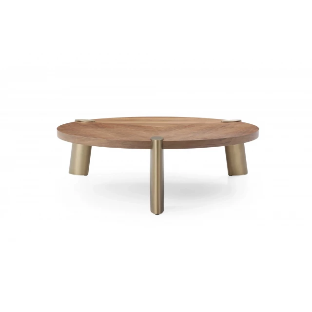 Gold solid wood round coffee table with varnish finish and hardwood flooring detail