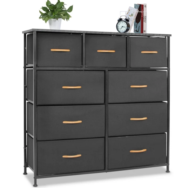 Black standard accent cabinet with nine drawers featuring wood chest of drawers and plant decoration