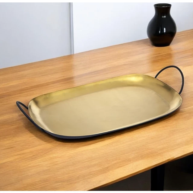 rectangular stainless steel serving tray with handles on wooden table