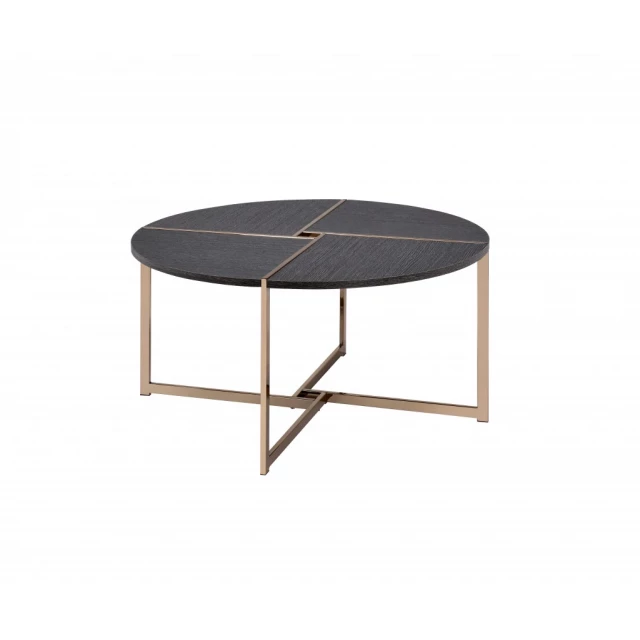 Champagne black round coffee table with wood elements and tableware on outdoor furniture setting