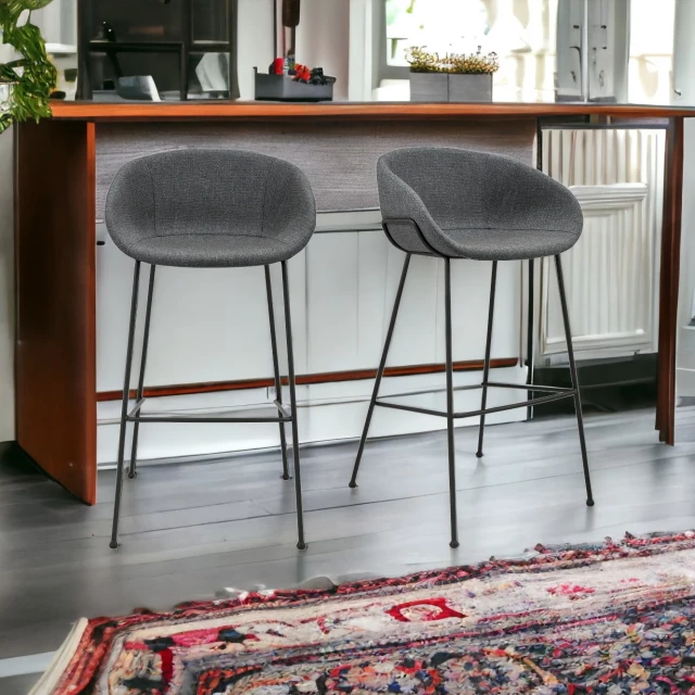 Low back bar height bar chairs in white with wood flooring and interior design elements