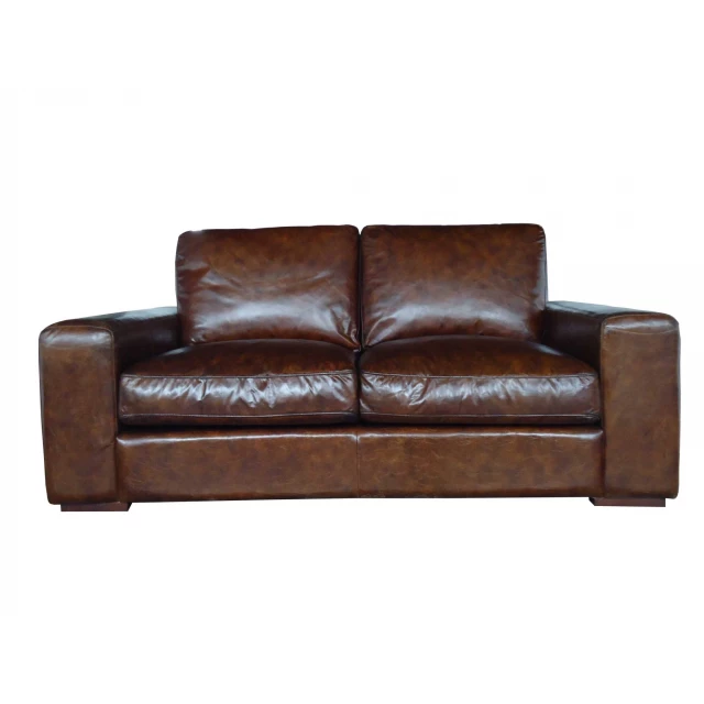 Brown leather sofa with wood armrests and natural materials for comfortable seating