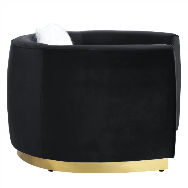 Black velvet curved love seat with beige accents and fashion accessory details