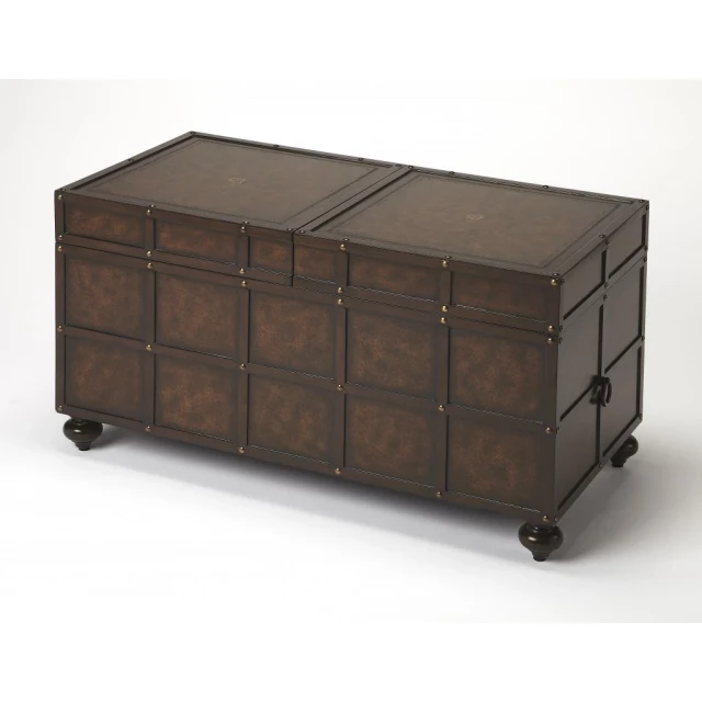 Brown faux leather storage coffee table with rolling wheels and wood accents