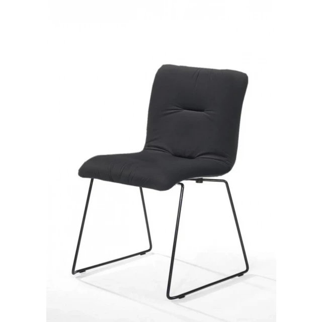 Dark gray velvet dining chairs with armrests and comfortable composite material on flooring