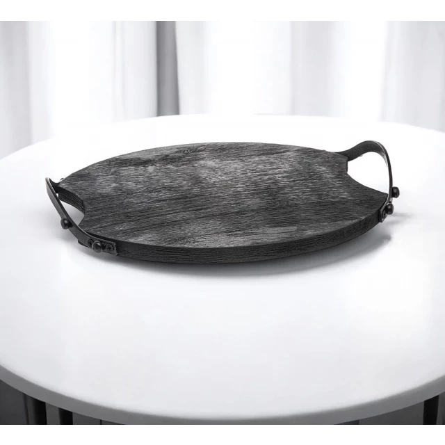 round wood metal serving tray with handles on table