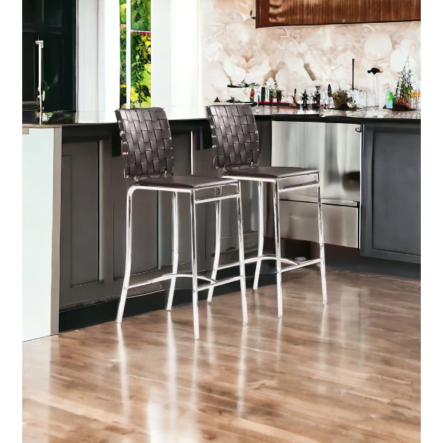 Low back counter height bar chairs in interior design with wood flooring and cabinetry