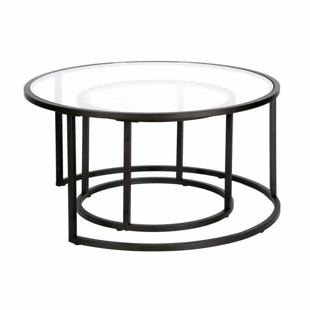 Round nested coffee tables with glass top and steel frame on display