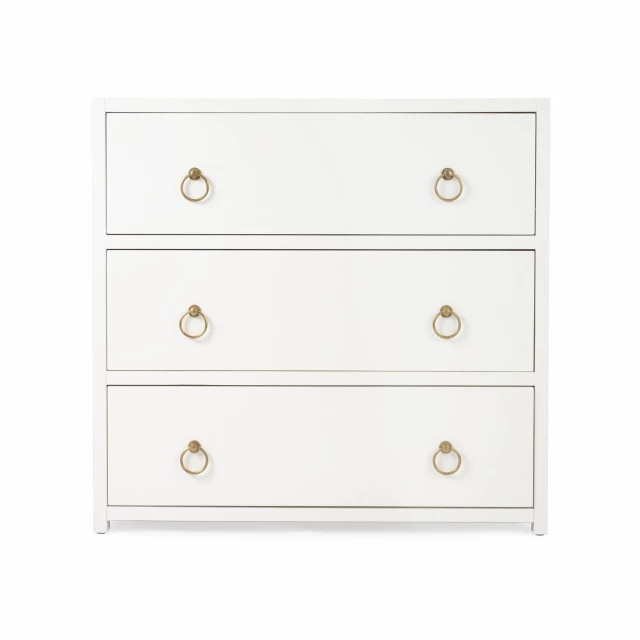 white manufactured wood drawer dresser with sleek handles