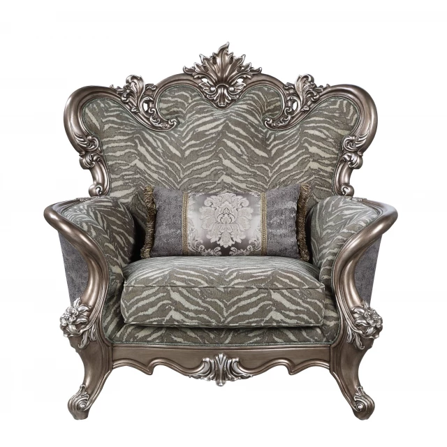 antique bronze floral tufted wingback chair with patterned wood armrests