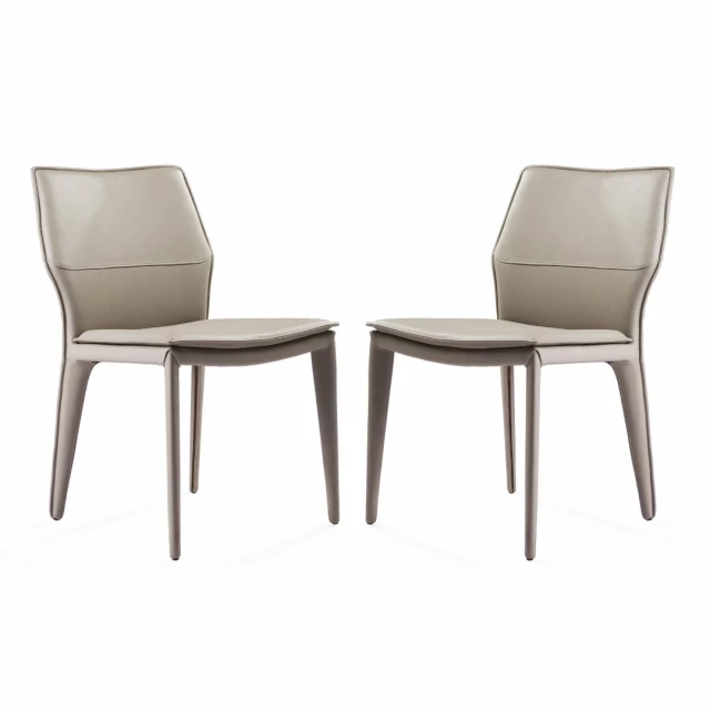 Gray faux leather metal dining chairs with armrests and wood accents