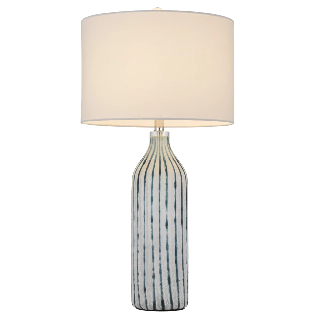 glass table lamp with white drum shade and metal base