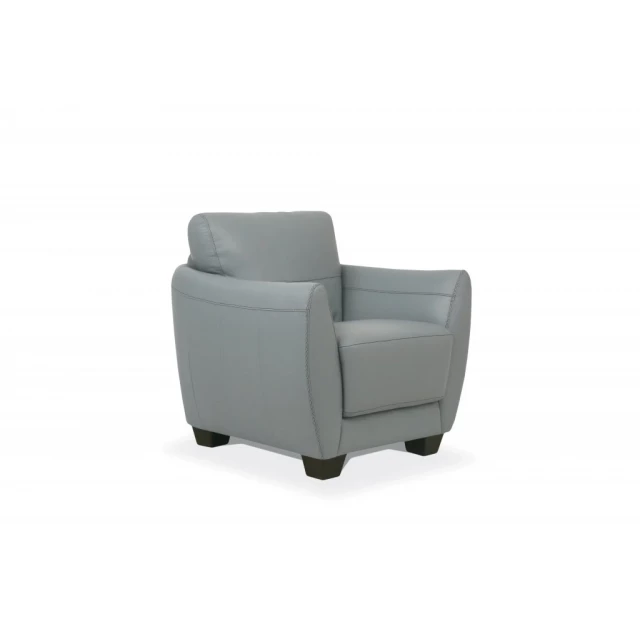 Black genuine leather armchair with comfortable armrests and beige accents