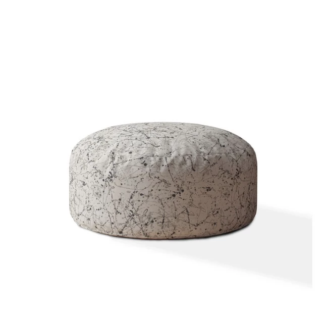 Beige flax round abstract pouf cover with natural material textures and metallic accents