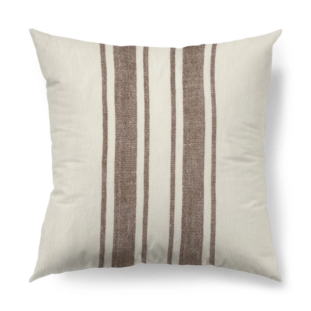 Off white pillow cover with brown stripes on a beige couch for comfort and home decor