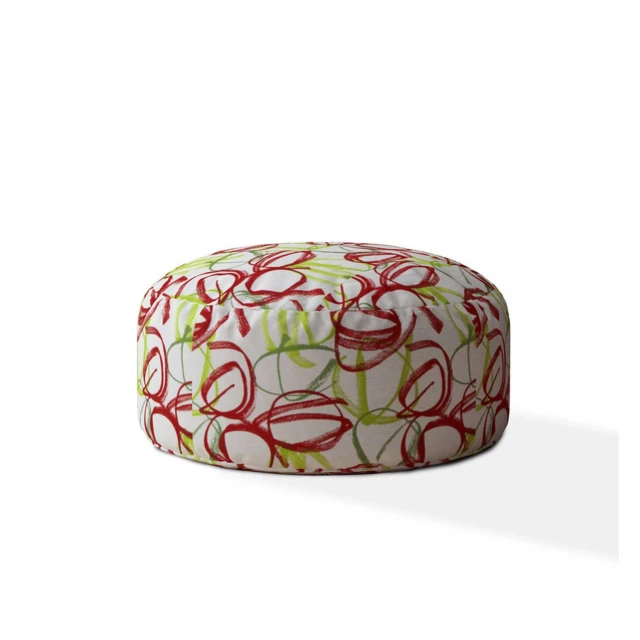 White cotton round pouf ottoman with abstract pattern in a creative arts style