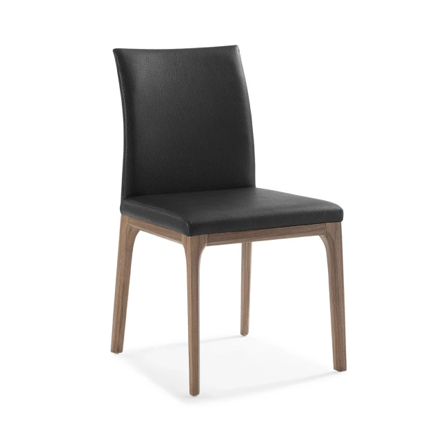 Black faux leather dining chairs with wood legs and comfortable seating