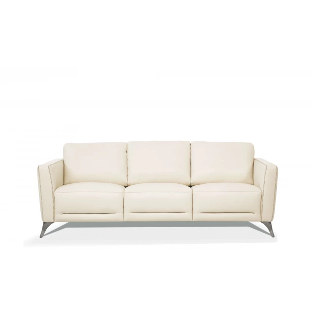 Cream leather black sofa with comfortable brown cushions and wooden legs