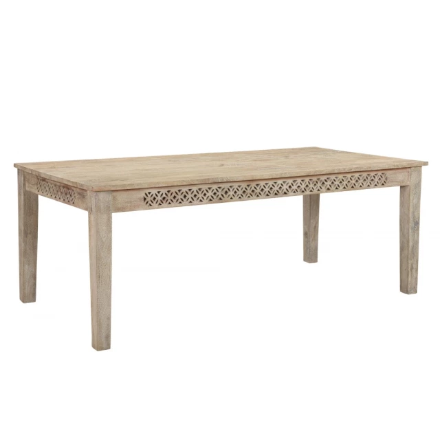 White solid wood dining table with bench in outdoor setting