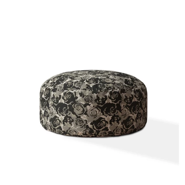 Beige canvas round floral pouf ottoman with natural material design and metal accents