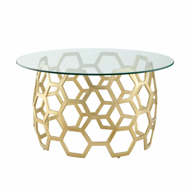 Gold glass iron round coffee table with dishware and porcelain on top in a furnished room