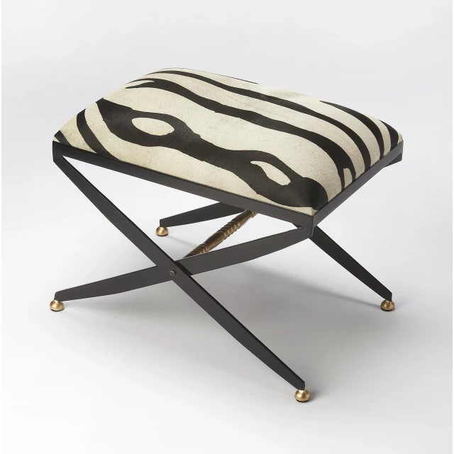 Black and white cotton blend ottoman with wood and metal accents suitable for outdoor furniture.
