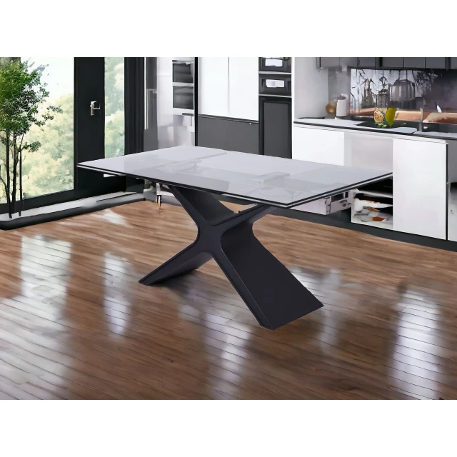 Drop leaf pedestal base dining table with chairs on wood flooring