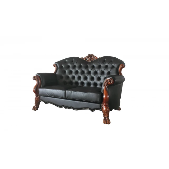 Brown faux leather loveseat with toss pillows and wooden armrests for cozy outdoor furniture setting