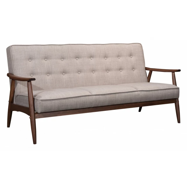 Beige brown polyester sofa with wood accents in a natural outdoor setting