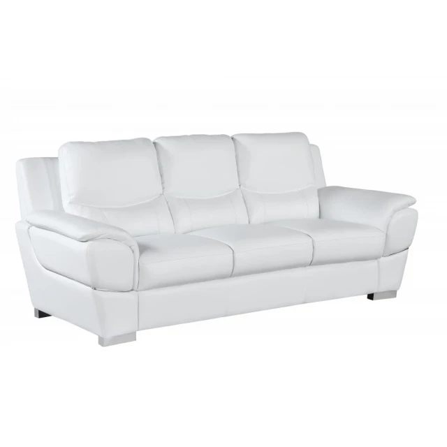 White silver leather sofa in a modern studio setting with comfortable cushions and sleek design